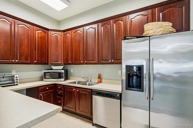 Welcome to this highly sought-after first-floor end unit located - photo 27