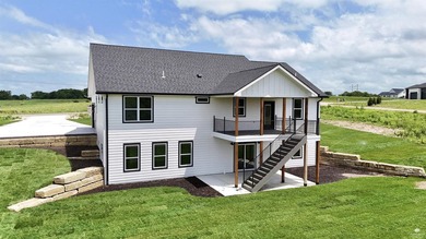 Set on two scenic acres with tranquil pond views, this - photo 3