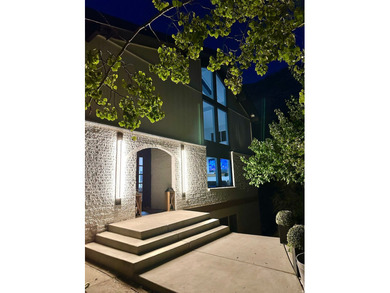 This beautifully remodeled home sits hidden, tucked away on a - photo 1