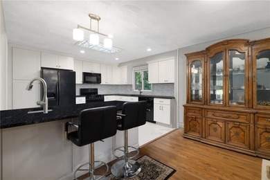 THIS OVERSIZED RAISED RANCH SITS IN A QUIET NEIGHBORHOOD IN - photo 19