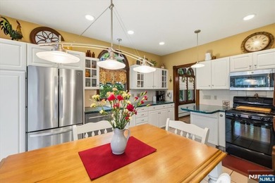 This home is gracefully positioned on a beautifully landscaped - photo 18