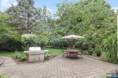 This home is gracefully positioned on a beautifully landscaped - photo 38