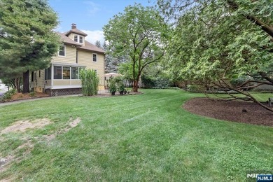 This home is gracefully positioned on a beautifully landscaped - photo 41