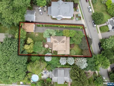 This home is gracefully positioned on a beautifully landscaped - photo 46