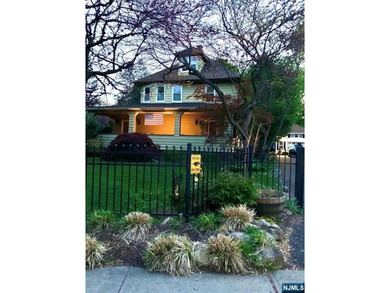 This home is gracefully positioned on a beautifully landscaped - photo 49