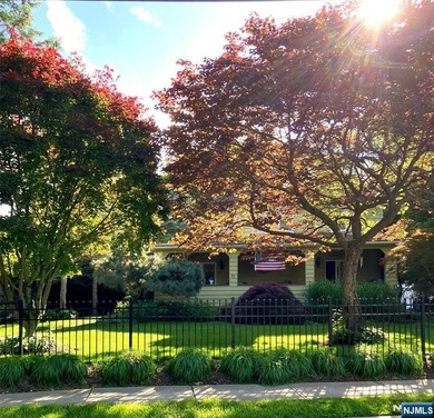 This home is gracefully positioned on a beautifully landscaped - photo 50
