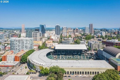 Enjoy west-facing city, sunset, and stadium views at this modern