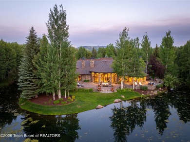Nestled amid tranquil water features with sweeping views of the - photo 1