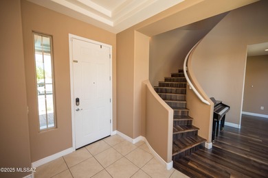 This gorgeous home is located the beautiful community of Saguaro