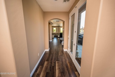 This gorgeous home is located the beautiful community of Saguaro