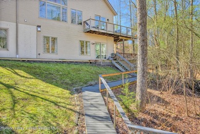 Commanding attention from the moment you enter, this waterfront - photo 4