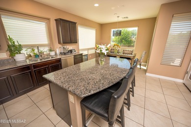 This gorgeous home is located the beautiful community of Saguaro