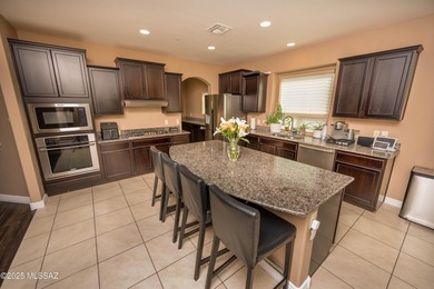 This gorgeous home is located the beautiful community of Saguaro