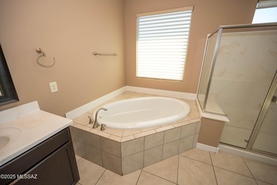 This gorgeous home is located the beautiful community of Saguaro