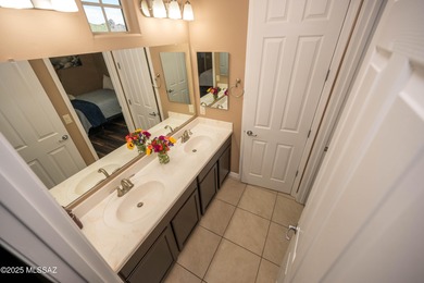 This gorgeous home is located the beautiful community of Saguaro