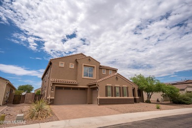 This gorgeous home is located the beautiful community of Saguaro