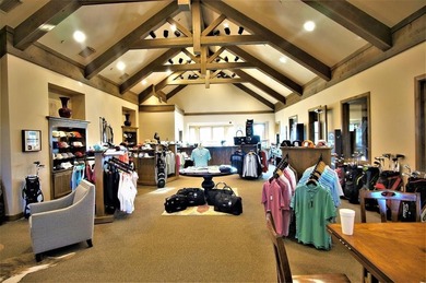 What a great view! This fully wooded lot in Pronghorn looks out