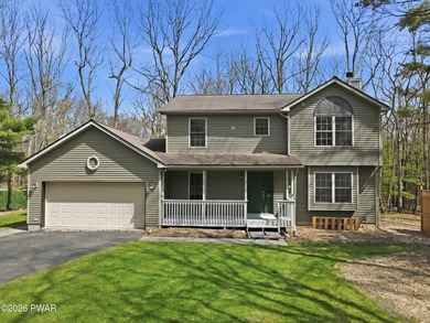 This beautifully maintained home sits on a 1-acre wooded - photo 1