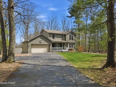 This beautifully maintained home sits on a 1-acre wooded - photo 2