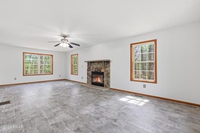 This beautifully maintained home sits on a 1-acre wooded - photo 4