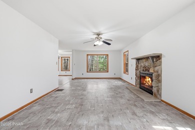 This beautifully maintained home sits on a 1-acre wooded - photo 5