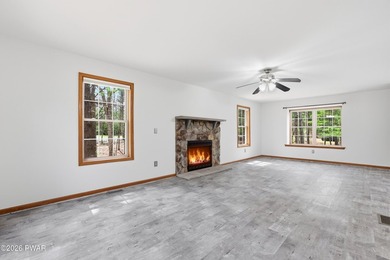 This beautifully maintained home sits on a 1-acre wooded - photo 6