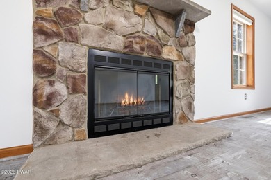 This beautifully maintained home sits on a 1-acre wooded - photo 7