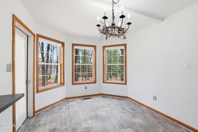 This beautifully maintained home sits on a 1-acre wooded - photo 8