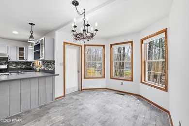 This beautifully maintained home sits on a 1-acre wooded - photo 9