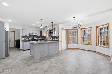 This beautifully maintained home sits on a 1-acre wooded - photo 10
