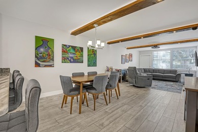 Welcome to this beautifully updated, light-filled corner unit - photo 1