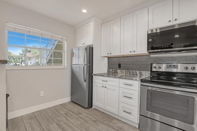 Welcome to this beautifully updated, light-filled corner unit - photo 6