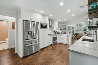 This lakefront home is a unicorn! Located within the gated - photo 12