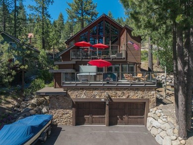Perched just steps from the shoreline, this extensively - photo 1