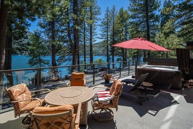 Perched just steps from the shoreline, this extensively - photo 3