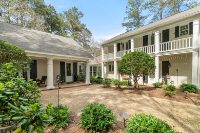 This charming Southern residence is gracefully set behind a - photo 11