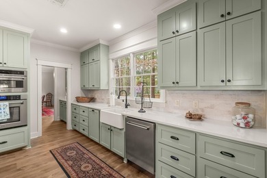 This charming Southern residence is gracefully set behind a - photo 25
