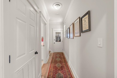 This charming Southern residence is gracefully set behind a - photo 42