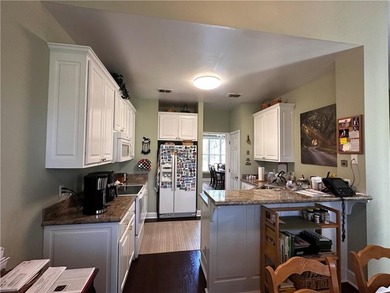 Standing in the entry foyer of this beautiful home, one is - photo 7