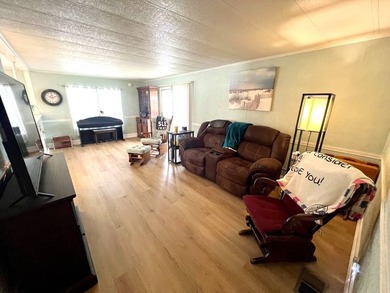 Welcome to this charming two-bedroom mobile home located in the - photo 18