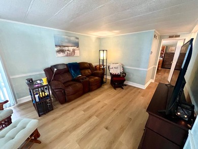 Welcome to this charming two-bedroom mobile home located in the - photo 21