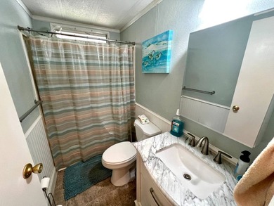 Welcome to this charming two-bedroom mobile home located in the - photo 25
