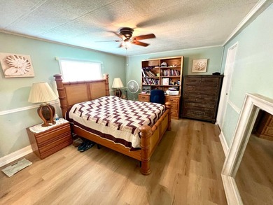 Welcome to this charming two-bedroom mobile home located in the - photo 26