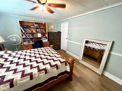 Welcome to this charming two-bedroom mobile home located in the - photo 27