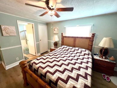 Welcome to this charming two-bedroom mobile home located in the - photo 28