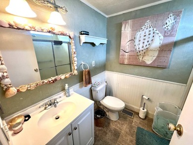 Welcome to this charming two-bedroom mobile home located in the - photo 29