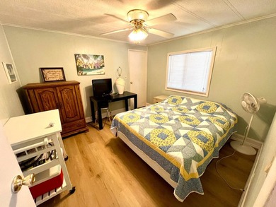 Welcome to this charming two-bedroom mobile home located in the - photo 31