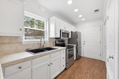 Enjoy peaceful lakeside living with modern updates in this - photo 4
