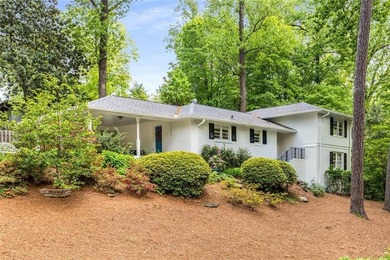 Nestled on a large + acre serene, corner lot in the highly - photo 1
