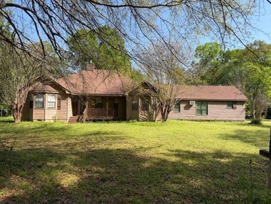 This unique house sits on approximately 3 acres. It has 3